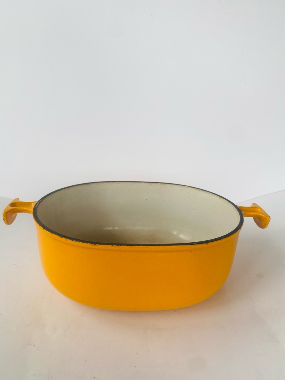 1970s Le Creuset 25 Yellow Orange Oval Enameled Casserole with Dual Handles